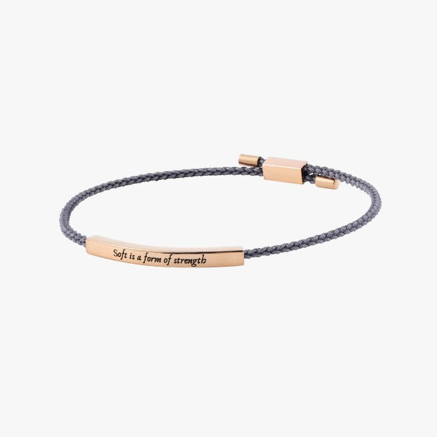 Bracelet with motivational message on a white background